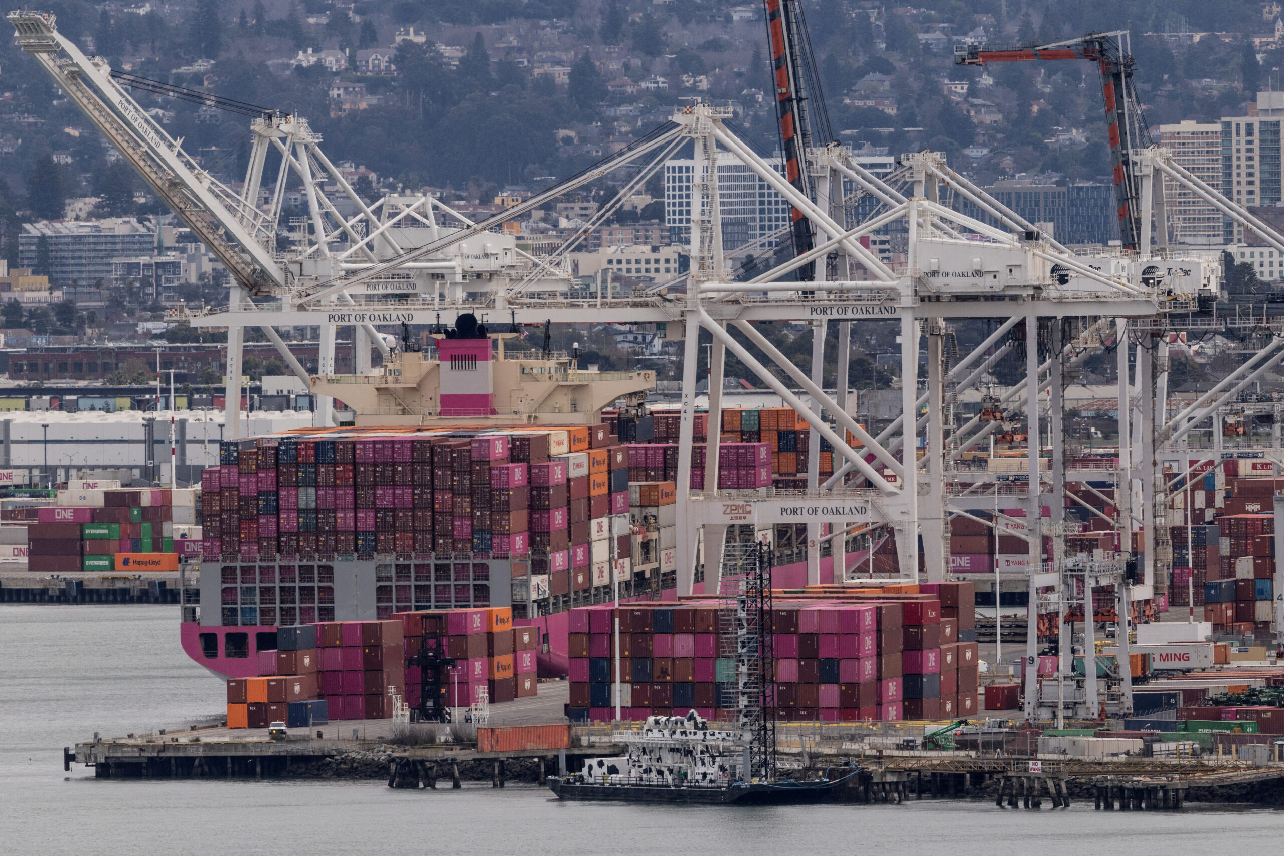FILE PHOTO: A cargo ship full of shipping containers is seen at the port of Oakland as trade tensions escalate over U.S. tariffs